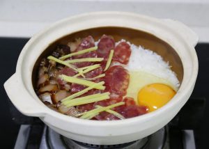 Crack the egg into the center of the pot