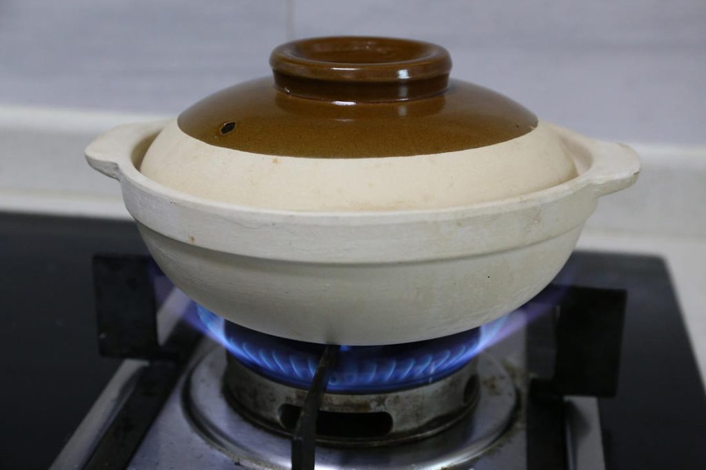 Drain the soaked rice and add it to the pot.
