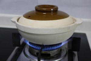 Drain the soaked rice and add it to the pot.