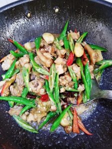 Add your chopped green and red bell peppers.