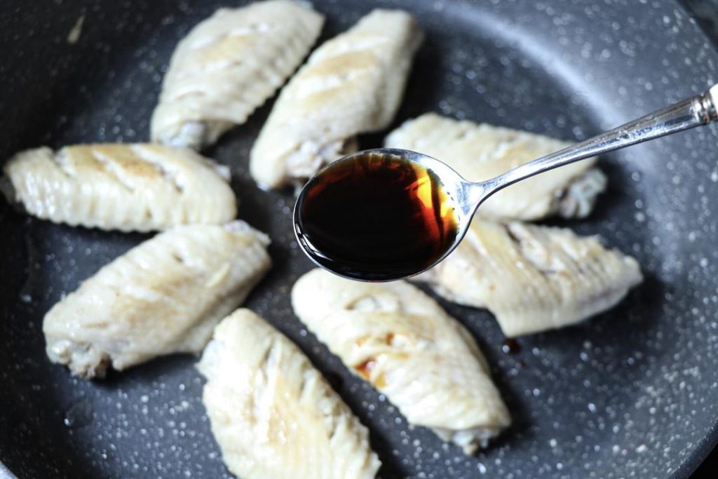 Add the 2 tablespoons of light soy sauce and 1 tablespoon of oyster sauce.