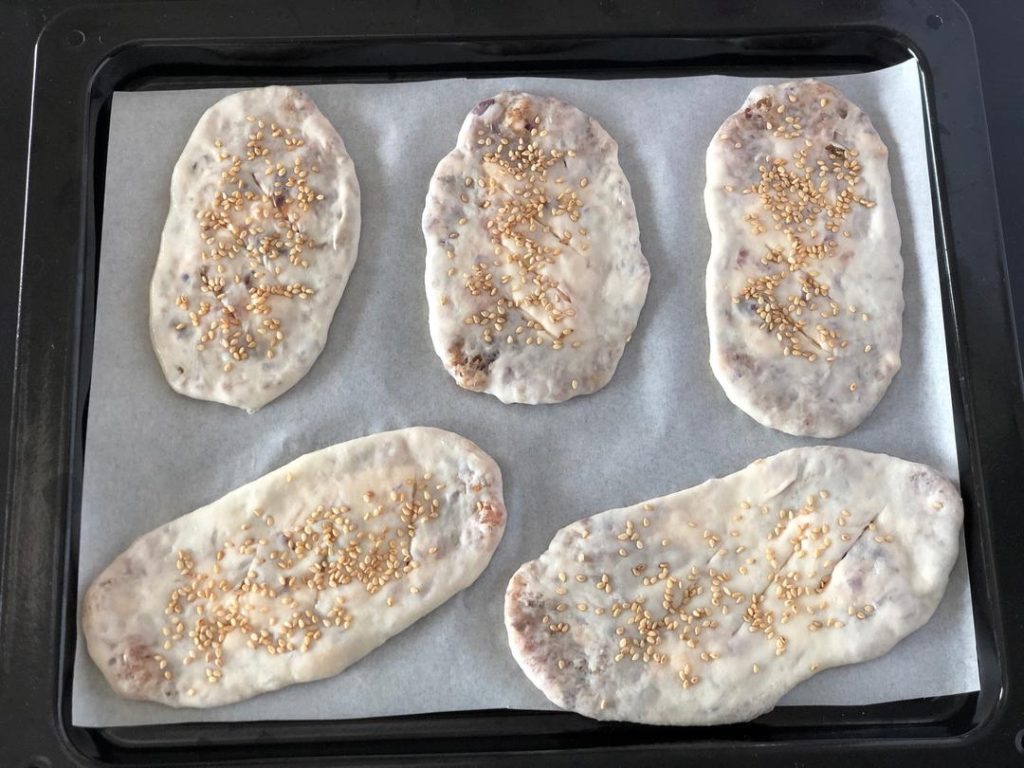 Place the pockets on the prepared baking sheet.