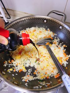 Add the light soy sauce. Stir well to distribute.