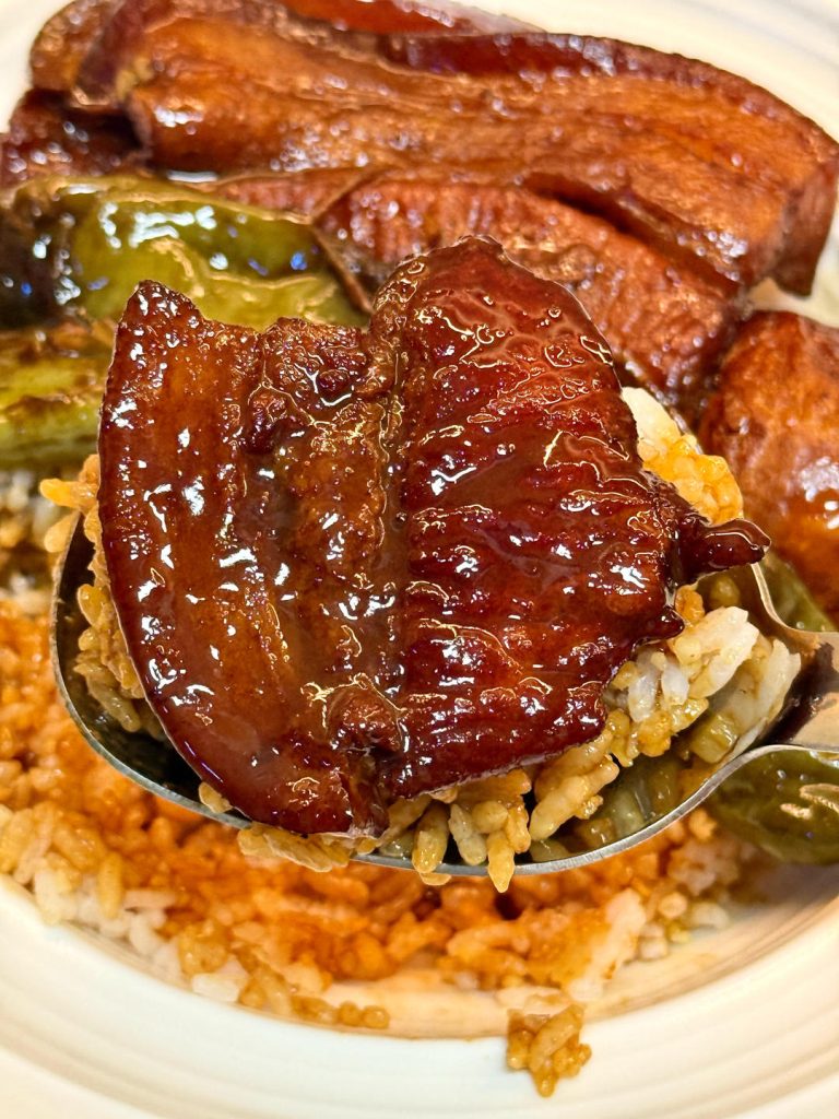 Finally, turn the heat up to high. Let the sauce boil and reduce, stirring occasionally, until it thickens into a glossy, dark gravy that coats the pork.