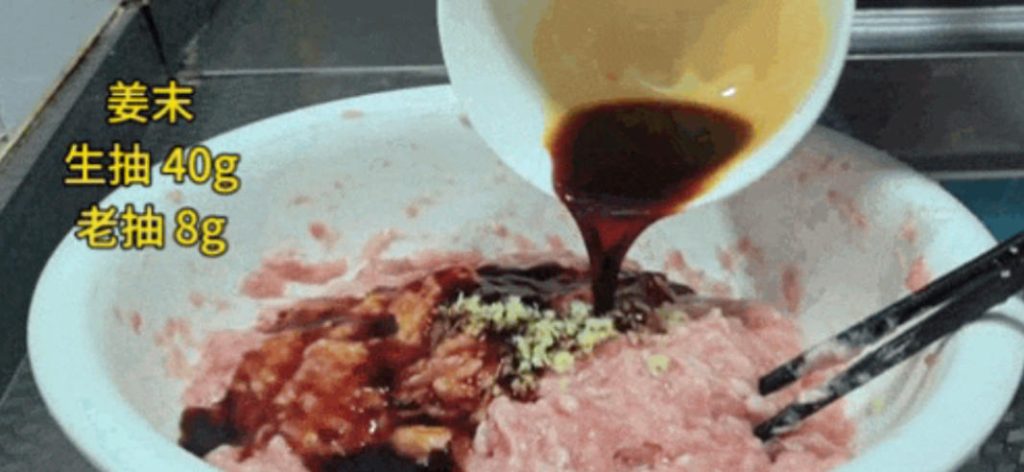 Add the minced ginger, 40g light soy sauce, and 8-10g dark soy sauce