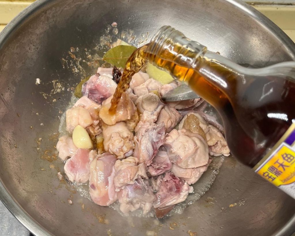 Pour the 2 tbsp of cooking wine around the edges of the pot