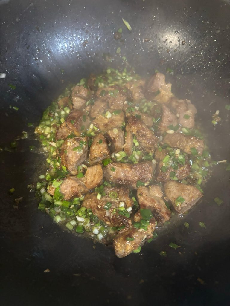 Add your prepared Salted Scallion Sauce all over the pork.