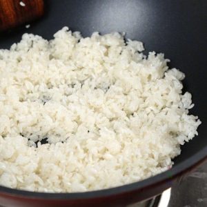Fry the Rice: In the same wok (wipe it out if needed), add another 2 tablespoons of oil. Add the cold rice.