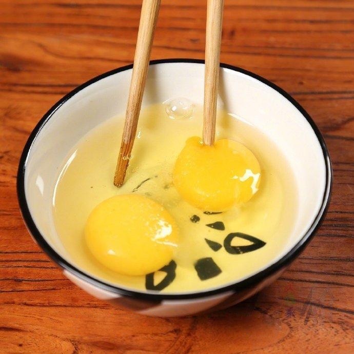 Prep the Egg: Crack 2 eggs into a bowl, add a pinch of salt, and beat thoroughly.