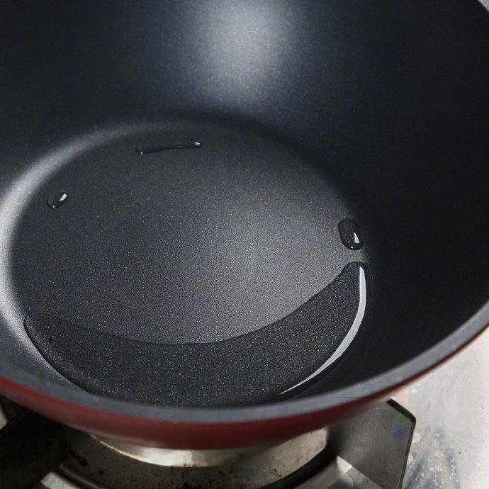 Fry the Rice: In the same wok (wipe it out if needed), add another 2 tablespoons of oil. Add the cold rice.