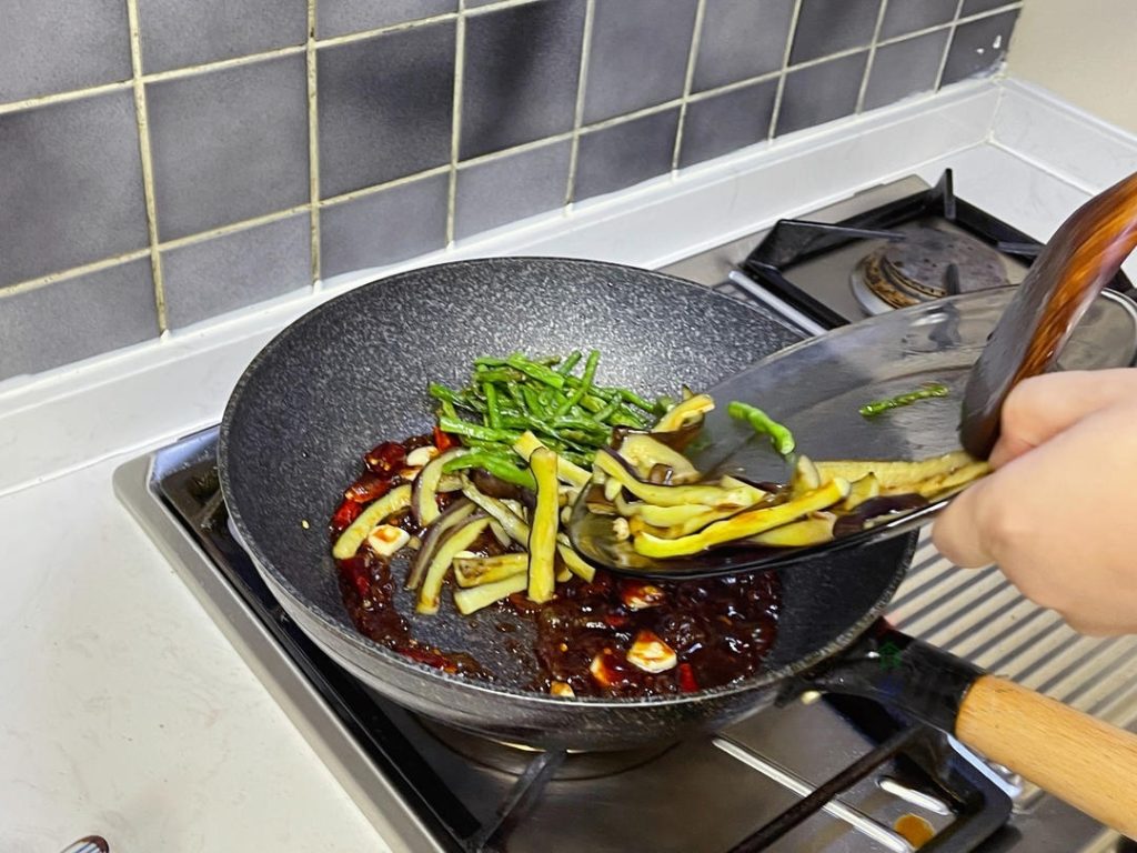 Return the eggplant and beans to the pan. Toss quickly to coat every piece in that thick, savory sauce.