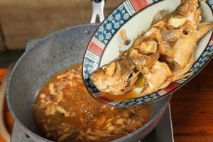 Reduce the Sauce Remove the lid. Gently transfer the fish to a serving plate (leave the sauce and mushrooms in the pot)