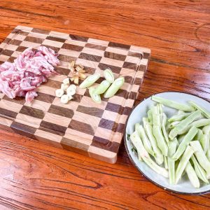 Wash the beans thoroughly and snap them into 2-inch segments by hand.