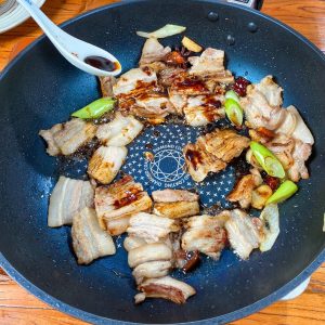 Add the separate 2 tablespoons of dark soy sauce directly to the pork.
