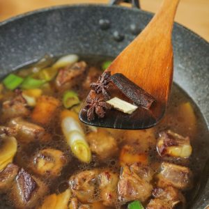 Pour in enough hot water to just barely cover the ribs.