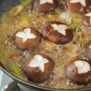 Add the 2/3 tablespoon of salt now. Add the shiitake mushrooms. Cover the pot, reduce the heat to low, and simmer for 25 minutes.