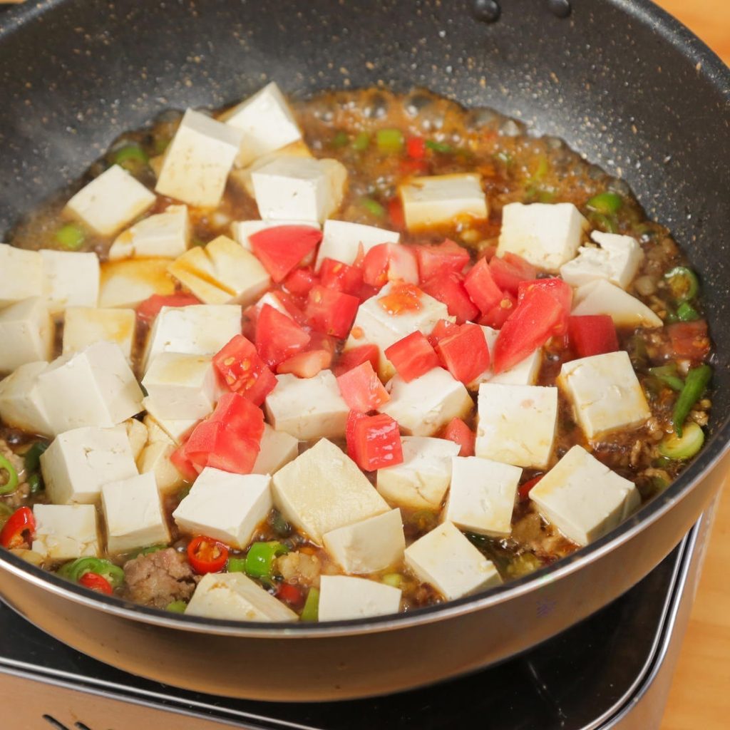 gently slide in the tofu cubes followed by the diced tomatoes