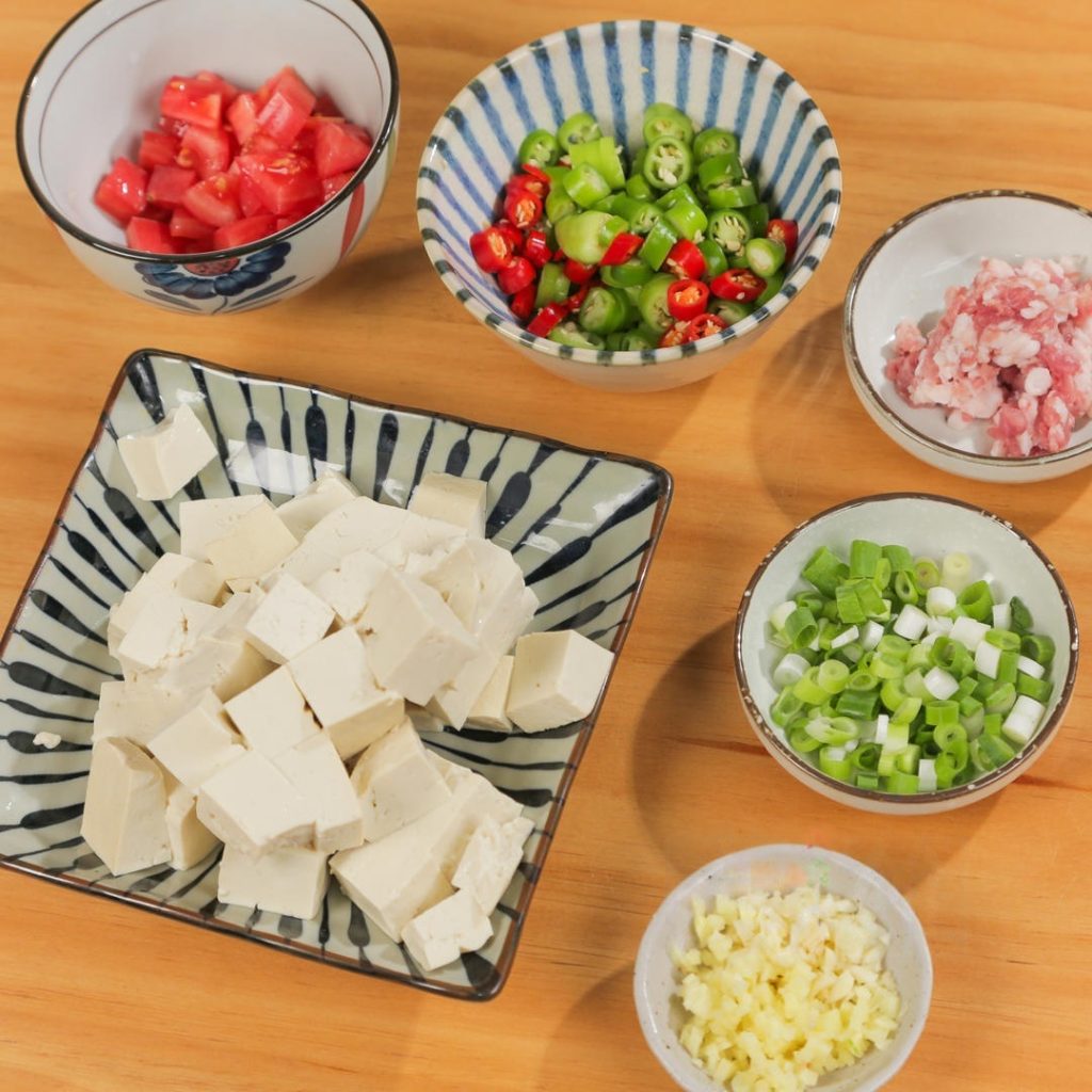 Cut the Tofu: Slice the block into uniform 1/2-inch cubes. And Prep Vegetables