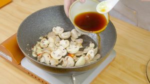 Pour in your pre-mixed sauce (Light Soy Sauce, Dark Soy Sauce, Oyster Sauce, and water).