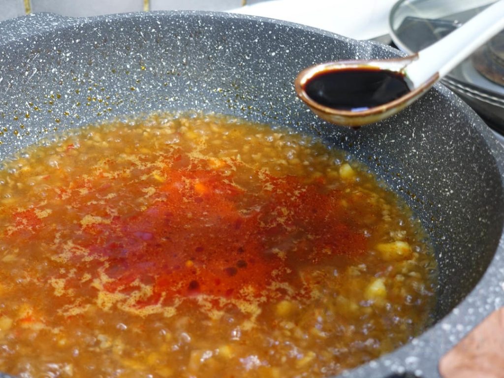 Create the Broth: Pour in the water (cold or hot is fine). Add 1 tablespoon light soy sauce, 1 tablespoon dark soy sauce, and ½ teaspoon sugar. Bring this liquid to a boil.