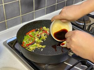 Pour your pre-mixed sauce directly onto the hot metal.