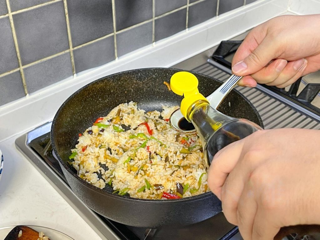 Right before turning off the heat, drizzle 1/3 tablespoon of Chinese Black Vinegar along the edge of the hot wok