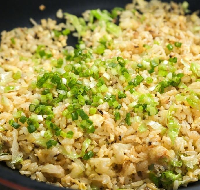 Finally, add the shredded lettuce and the chopped scallions.