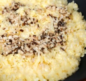 Add the blanched shiitake mushroom cubes to the rice.