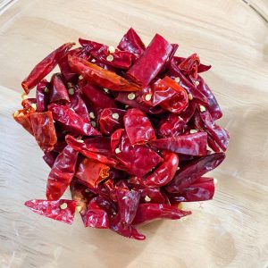 Place the prepared chili segments into your heat-resistant container