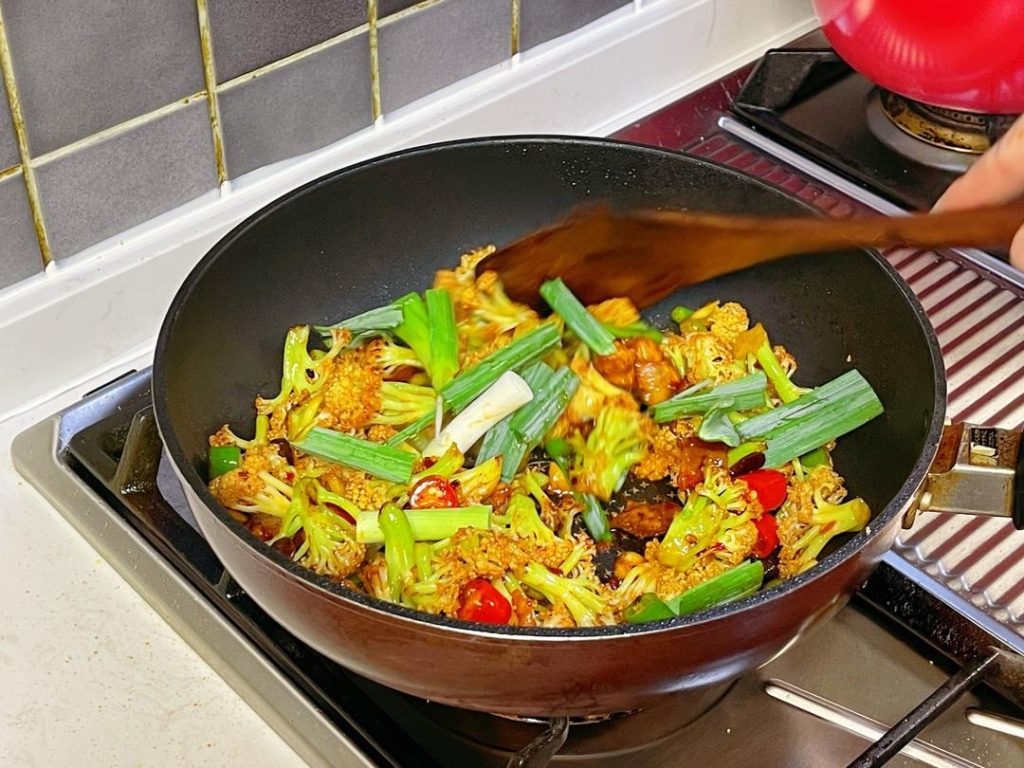 then toss everything together until the cauliflower is glossy and coated.