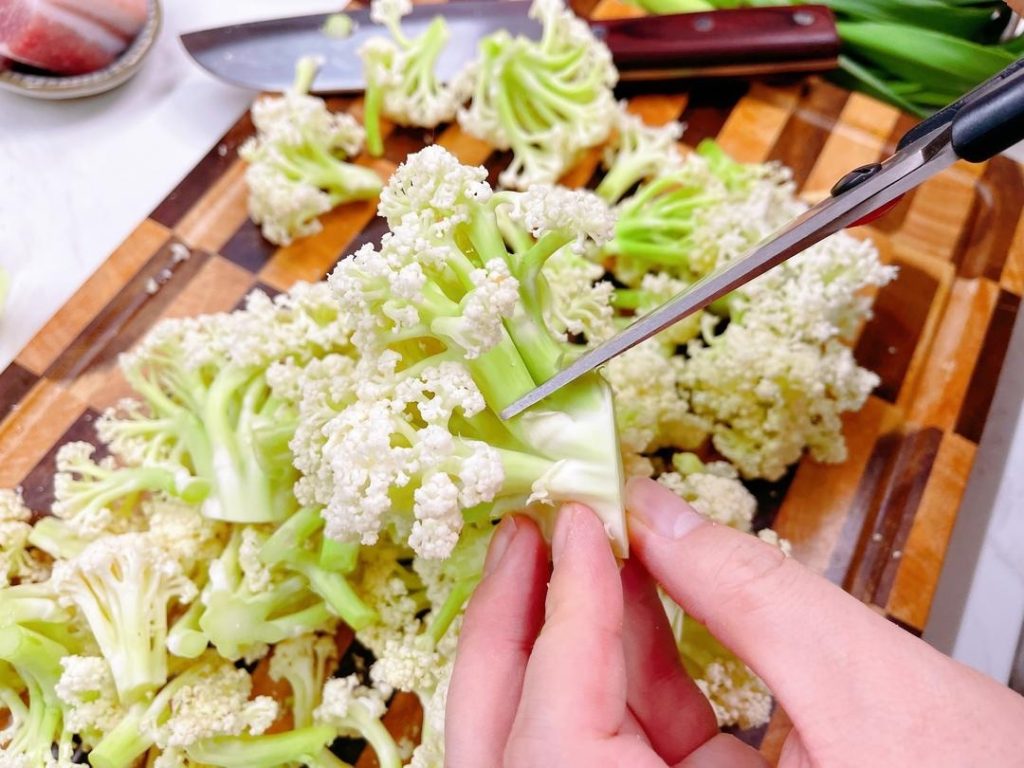 Cut the cauliflower into small, bite-sized florets.