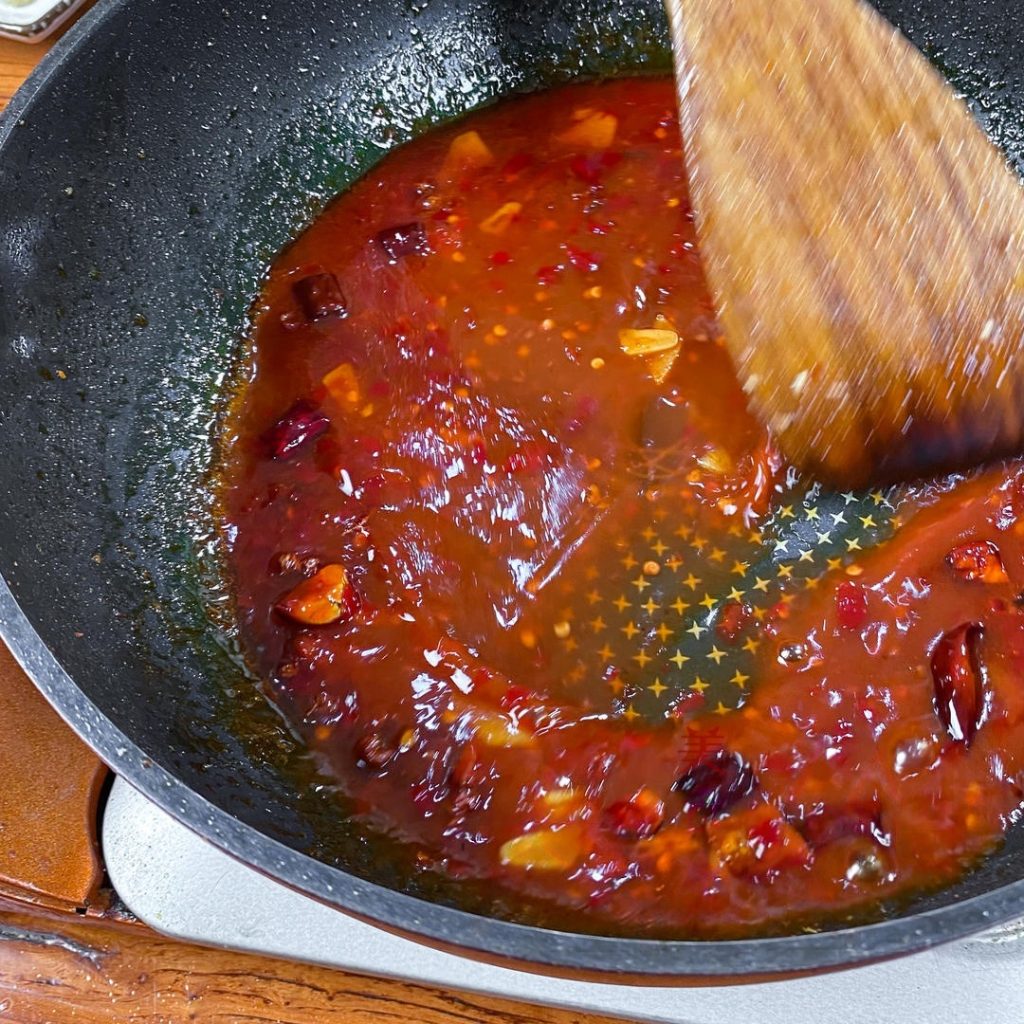 Pour the pre-mixed "Mystery Sauce" into the pan. Stir constantly.