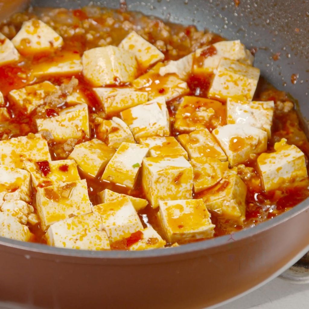 Pour the pre-mixed "Secret Sauce" into the pan with the meat. Bring it to a boil.