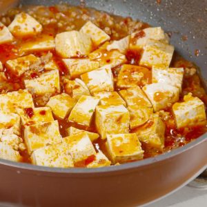 Pour the pre-mixed "Secret Sauce" into the pan with the meat. Bring it to a boil.