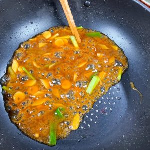 Pour in the sauce mixture. Stir constantly as it bubbles;