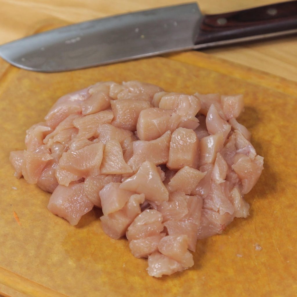 Dice the chicken breast into small, uniform cubes