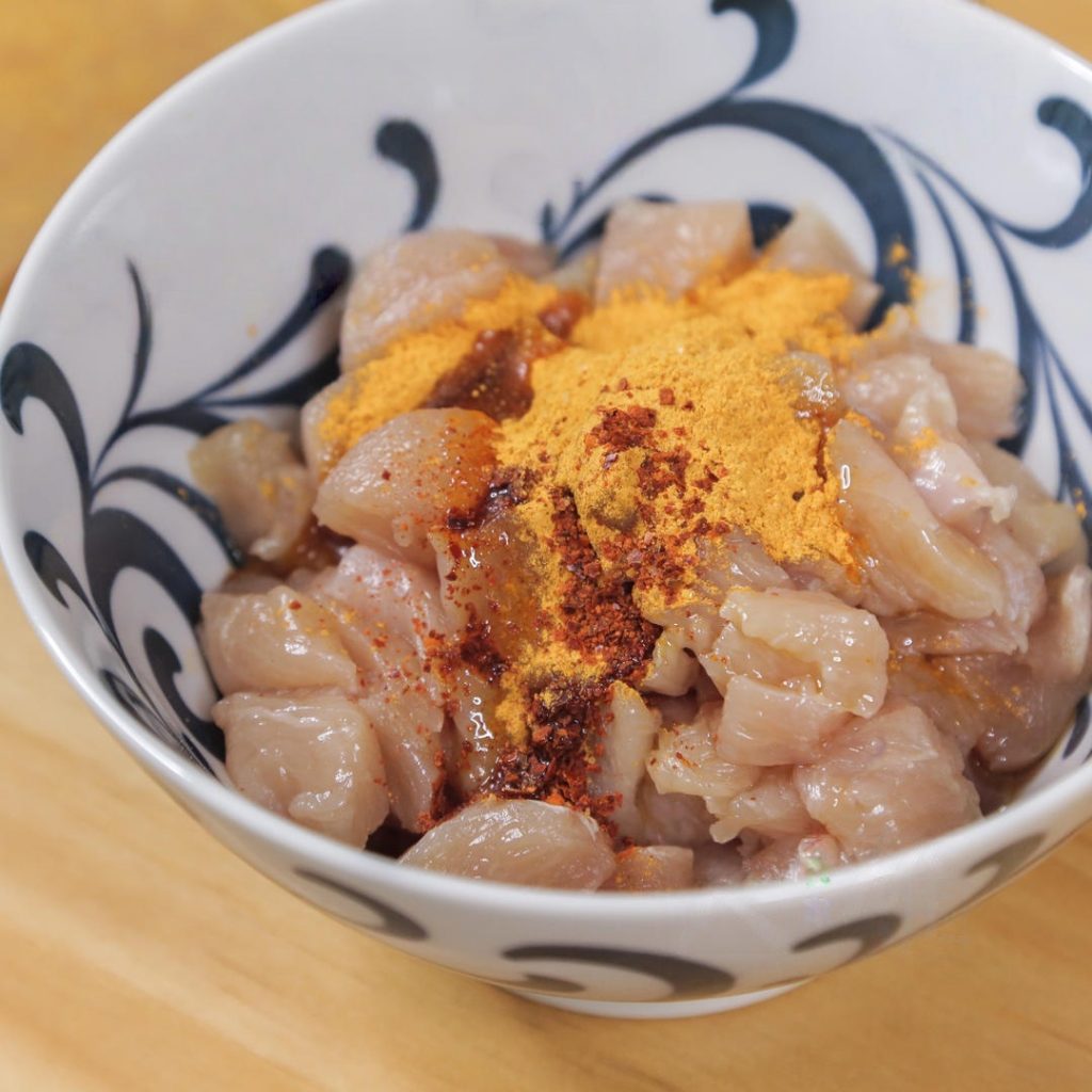 Marinate the Chicken In a mixing bowl, combine the diced chicken with 5 tablespoons of Orleans Marinade powder.