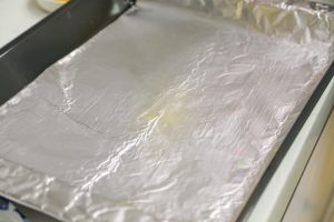 Prepare the Baking Sheet Line a baking sheet with aluminum foil or parchment paper.