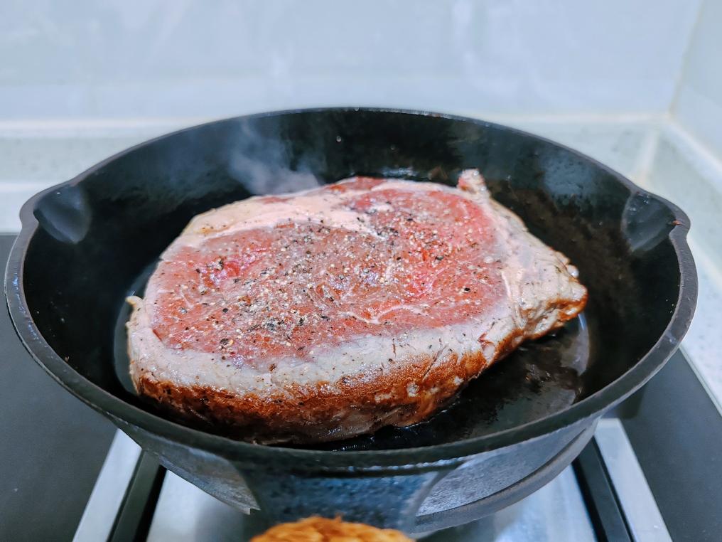 The First Sear Lay the steak flat in the pan