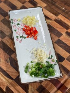 Finely chop the scallions and garlic