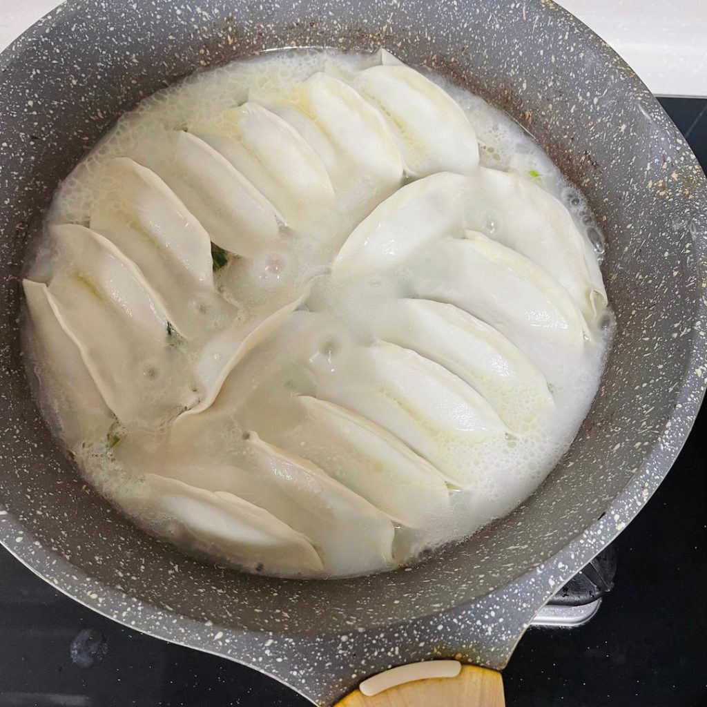 Give your slurry a quick whisk (starch settles) and pour it into the pan