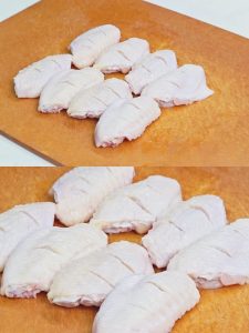 Use a sharp knife to make 2-3 slashes (scores) on both sides of each wing.