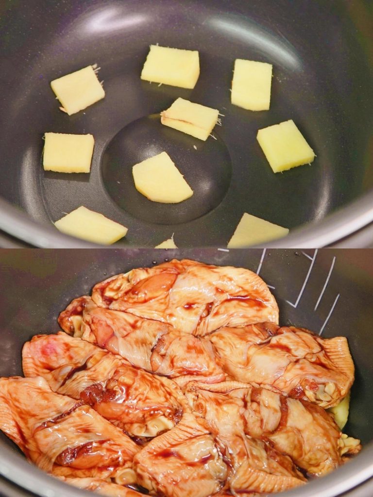 Place the sliced ginger at the bottom of the rice cooker pot and Lay the marinated chicken wings on top of the ginger.