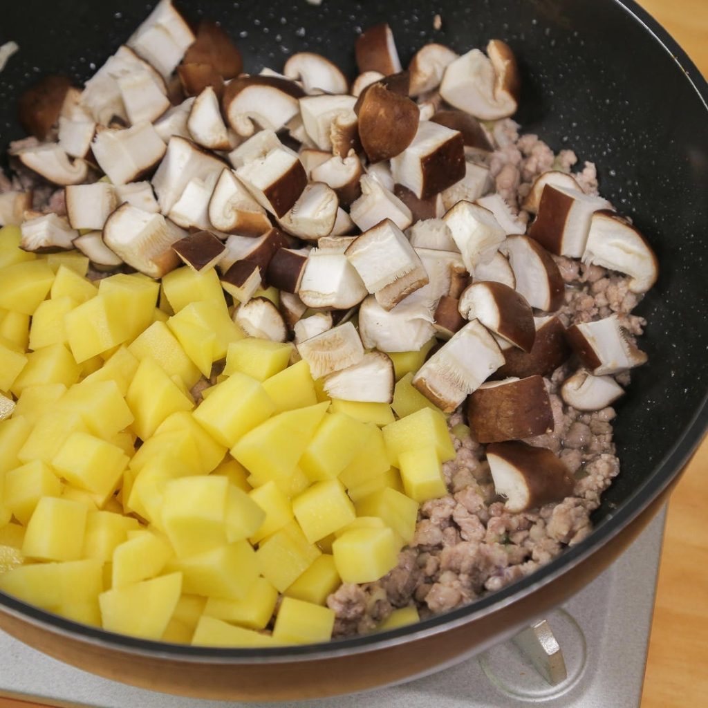 Toss in the diced mushrooms and potatoes