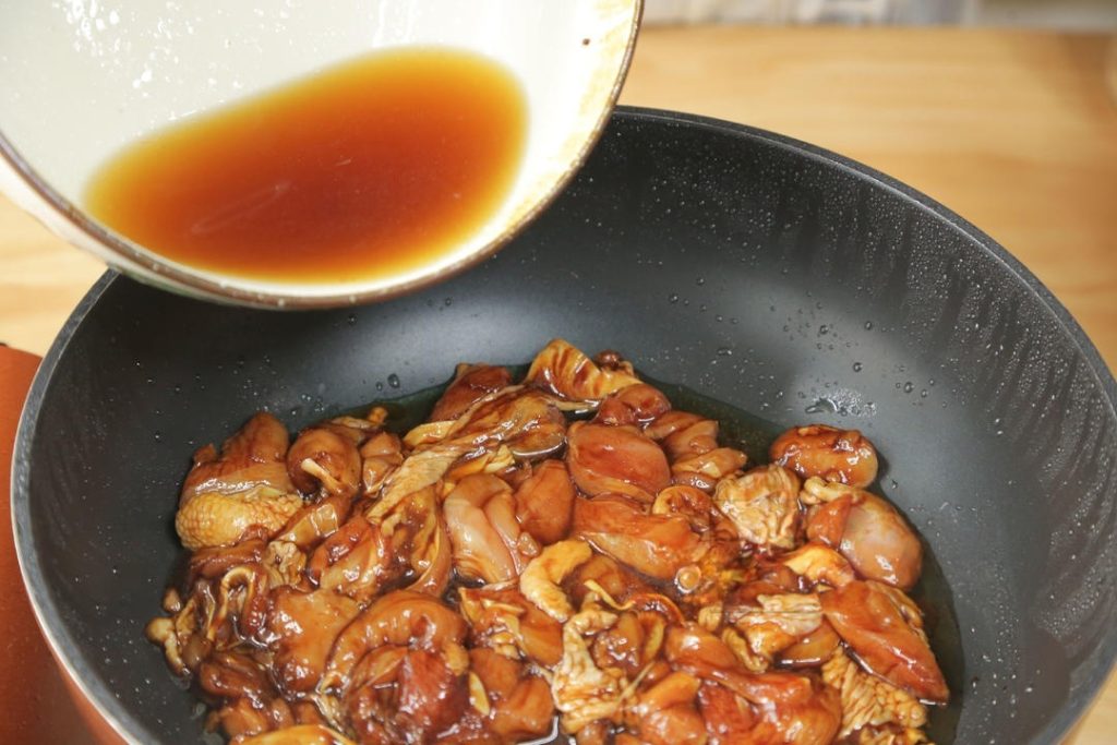 Add the reserved fried scallions back in, along with about 1/2 cup (120ml) of water.