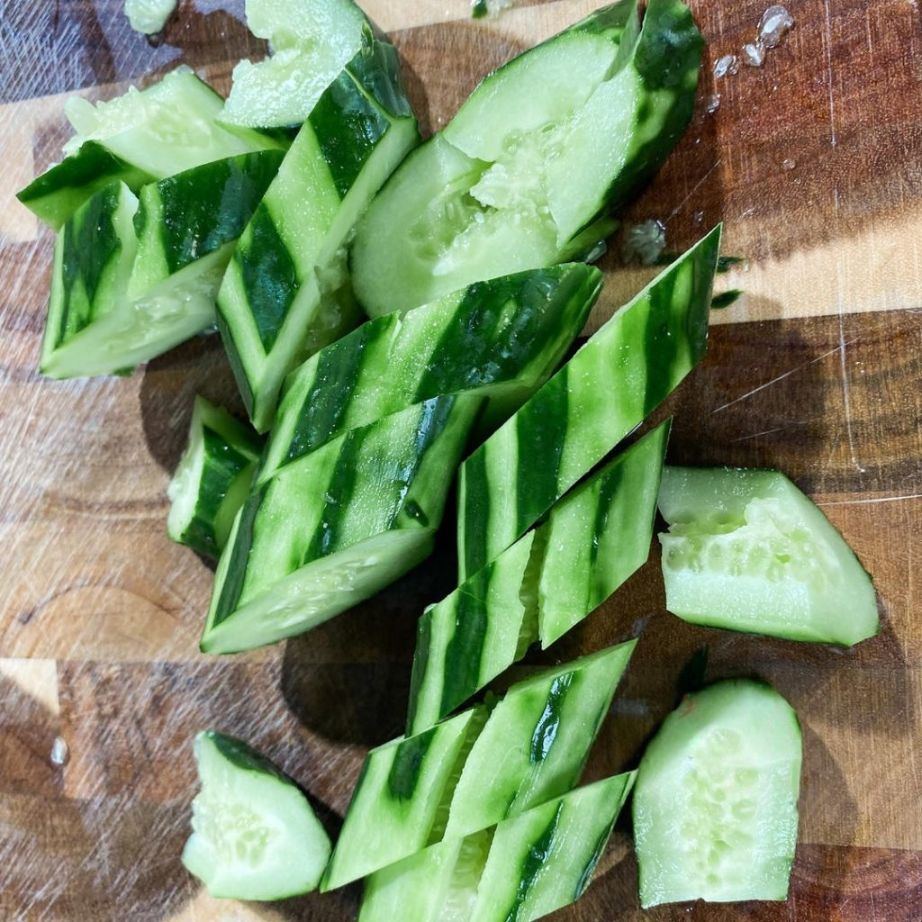 Cut Once smashed, cut the cucumber into bite-sized chunks using a diagonal cut