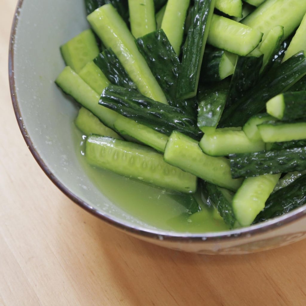 Place your cucumber strips in a large bowl. Add about 2 tablespoons of salt (or 1 "porcelain spoon" as we say in the family kitchen). Toss well to coat.