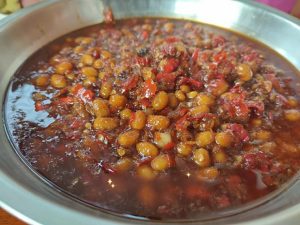 Stir in the white liquor (Baijiu) and rock sugar