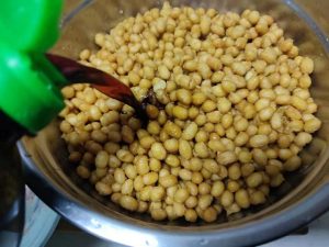 Pour the Light Soy Sauce over the fried beans until they are completely submerged