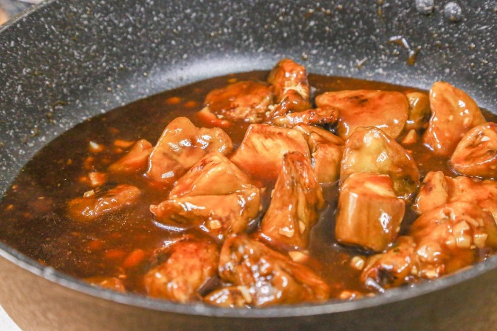 Combine Add the fried eggplant back into the pan. Toss quickly to coat every piece in the thick, glossy sauce.